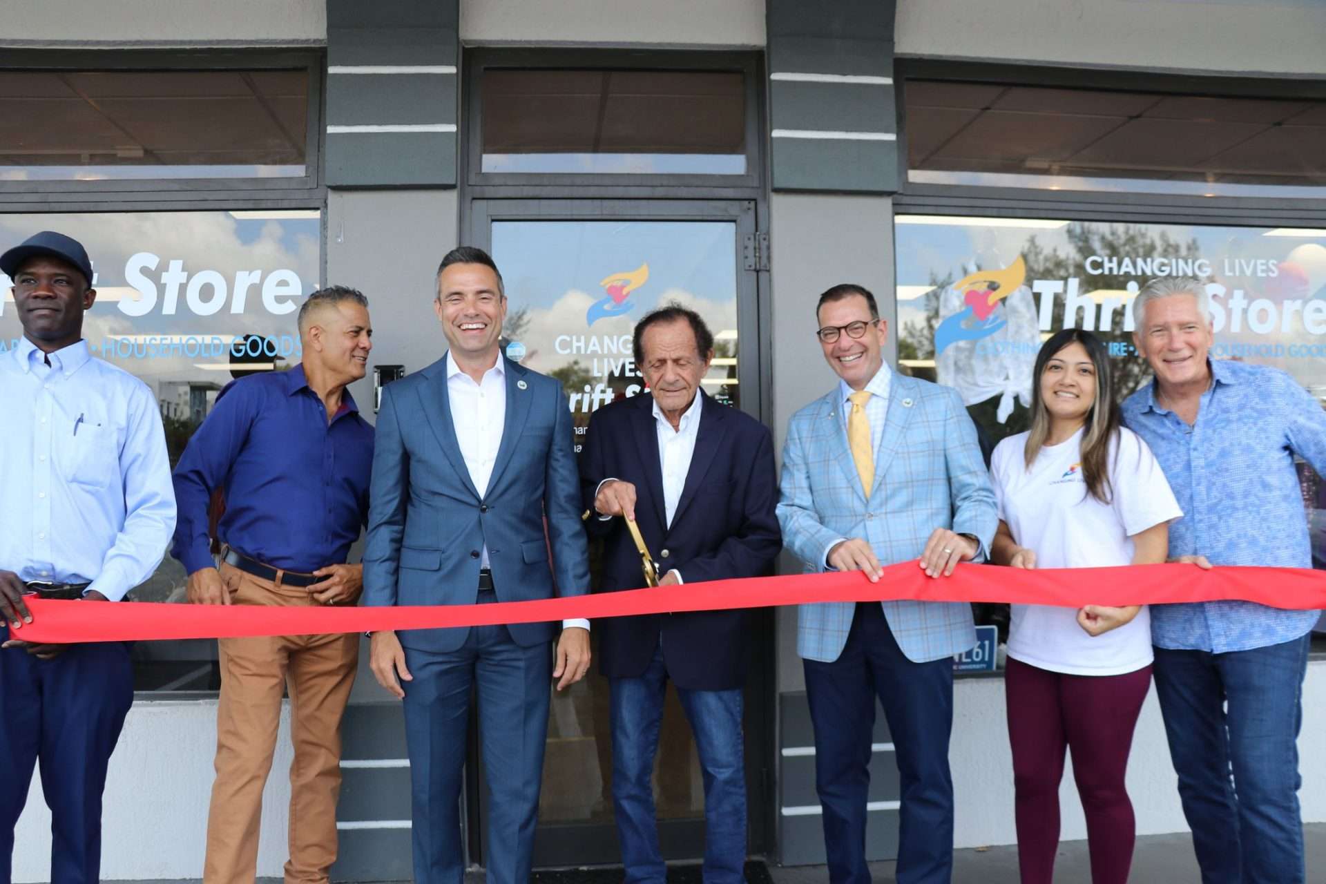 Ribbon-cutting ceremony for Changing Lives Thrift Store in Boca Raton with local leaders and nonprofit team.